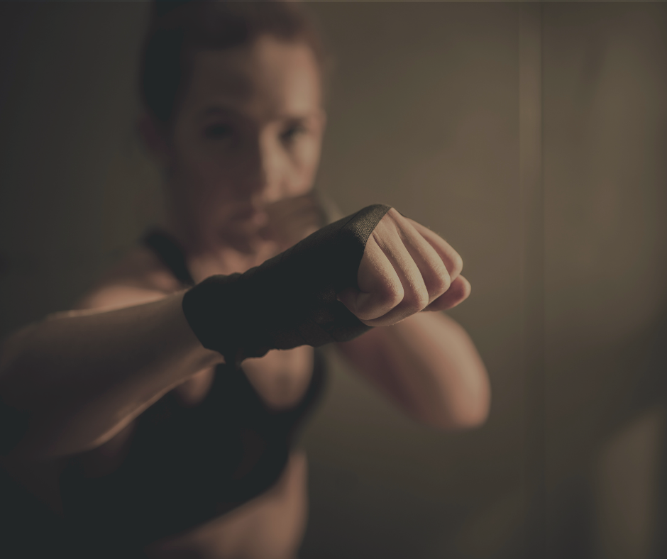 Woman in a guard stance with wrapped hands